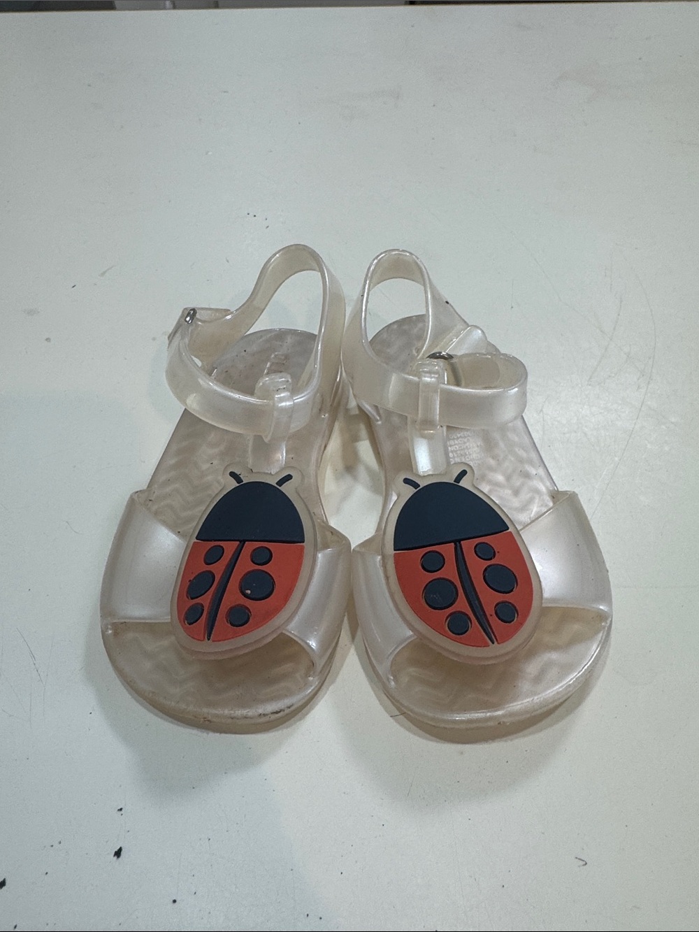 Clear Kids Jelly Sandals with Red Ladybug Accent